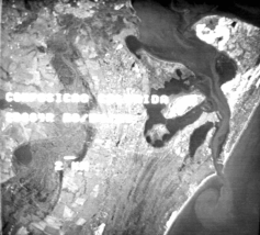Figura 8. Imagem de satélite mostrando a desembocadura da Lagoa dos Patos e região praial com a formação de um vórtice na pluma de sedimentos que sai da Lagoa.