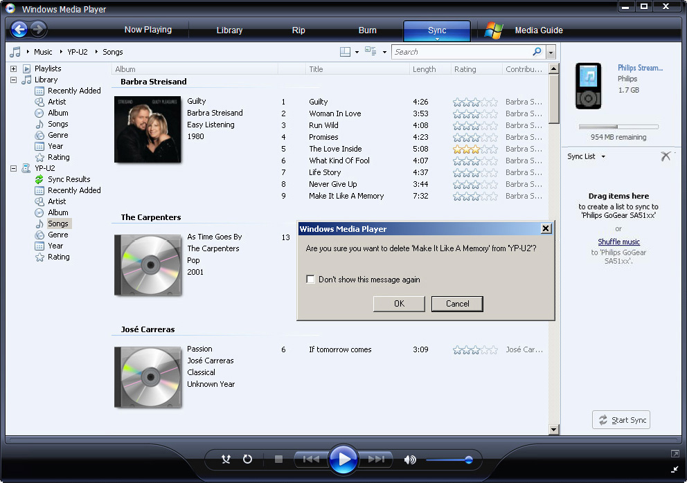 2 Para excluir arquivos de música, clique na seta no canto superior esquerdo do Windows Media Player e selecione Música. Para excluir arquivos de imagens, selecione Imagens.
