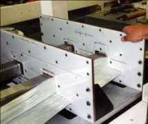 Dry reinforcements (fibers, fabrics, mats, etc.) are pulled from a creel into forming tooling 2.