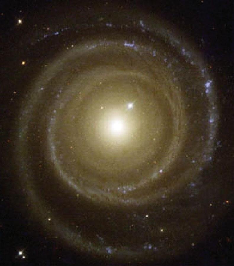 Galáxias Espirais 3 componentes principais Disco [L exp( R/Rd)] Bojo [ aparência de uma mini galáxia elíptica] Halo