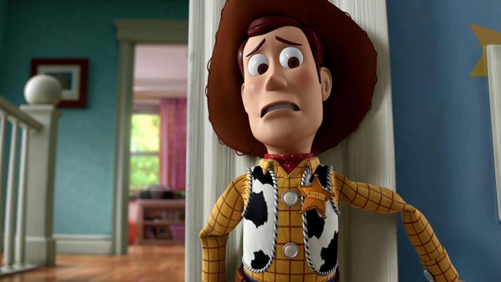30 Woody: Xerife do velho oeste, feito de pano e com uma cordinha nas costas.