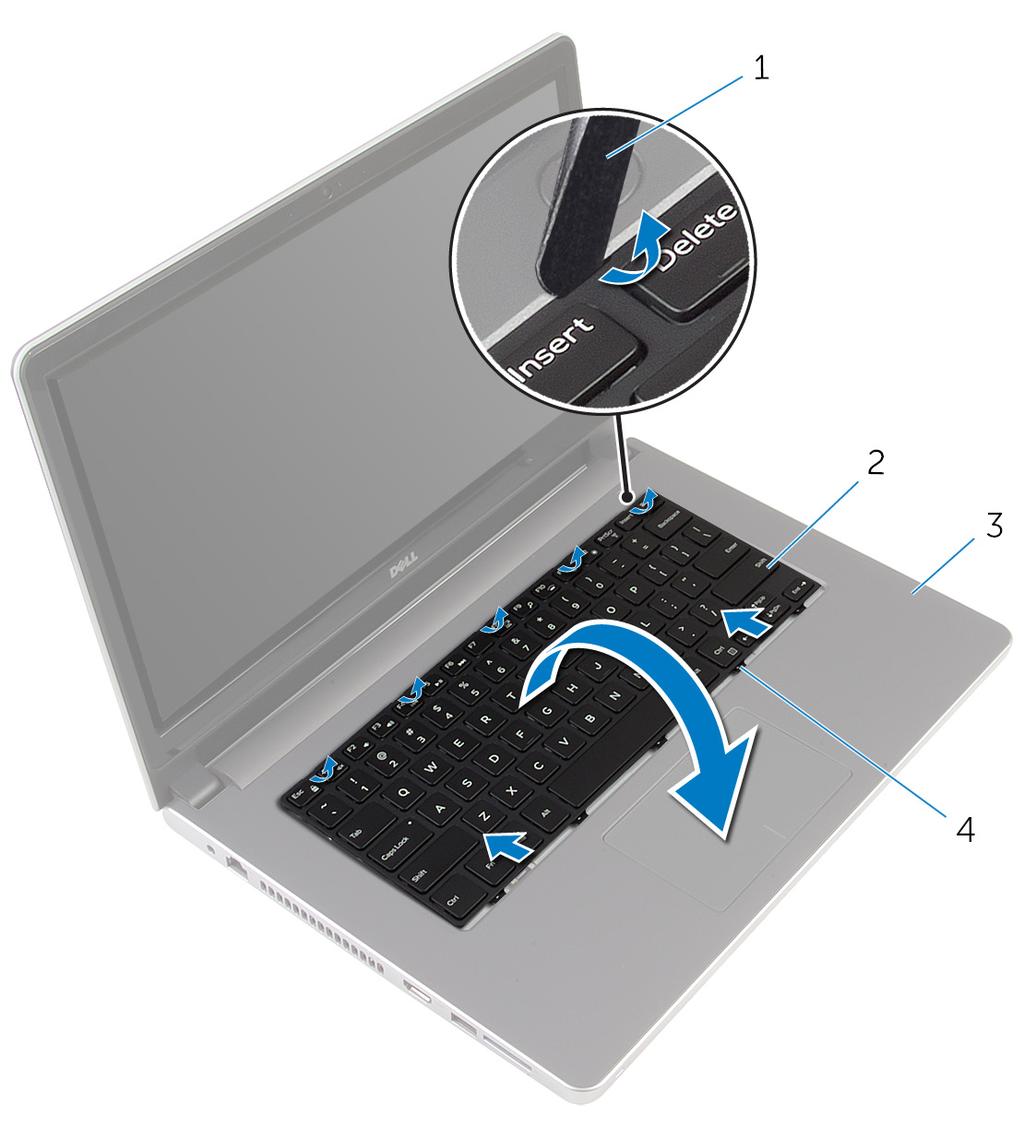 2 Utilizando um instrumento aguçado em plástico, solte as patilhas que fixam o teclado ao conjunto do apoio para as mãos.