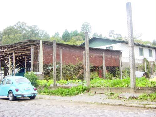 11 - TELHEIRO Construção constituída apenas de cobertura e seus apoios, destinada a proteção de materiais, veículos, máquinas ou similares. 11.