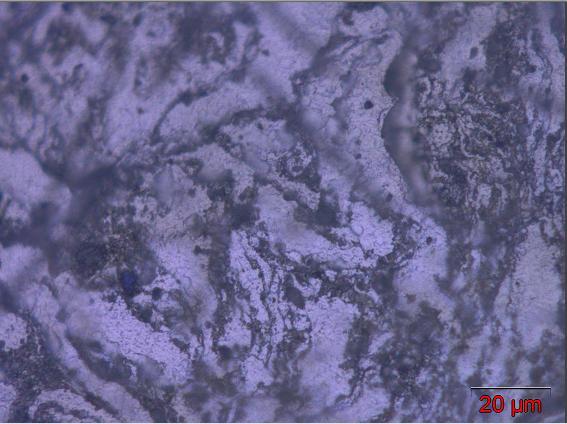 Micrografias do compósito reforçado com 15% em massa de AlN submetido à MAE durante 60 min, compactado e sinterizado.