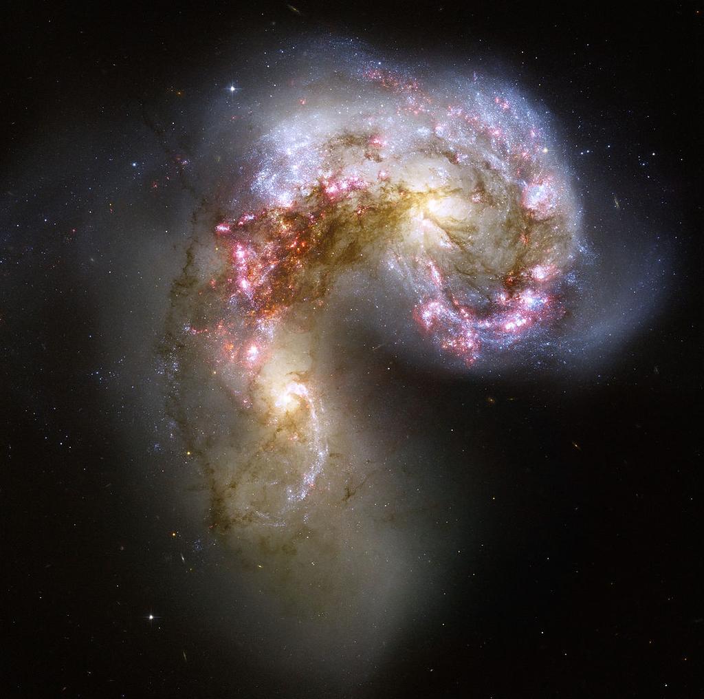 Galáxias starburst Algumas galáxias apresentam um surto de formação estelar. Podem ser confundidas com AGNs por causa do alto brilho e da cor azulada.