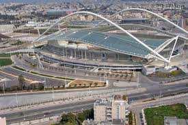 Aprendendo com o mundo O OAKA Stadium faz parte do Olympic Athletic Center of Athens Spiros Louis. Ele está aberto a visitas de grupos organizados, a partir de 15 visitantes.