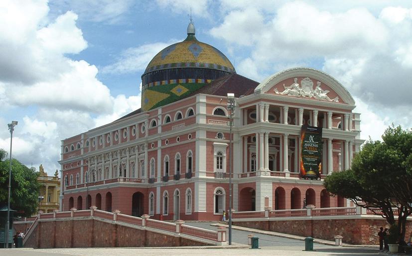 Proposto 5) (UFRJ) O mil e novecentos foi, em Manaus, (...) época de um esplendor artístico em desproporção com a paisagem agrestemente tropical que rodeava a um tanto postiça capital do Amazonas.