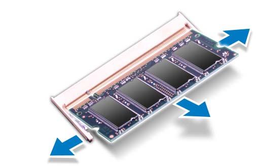 4 Use as pontas dos dedos para afastar cuidadosamente os clipes de fixação em cada extremidade do conector do módulo de memória até que o módulo se solte.