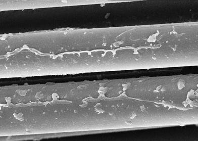 8 - Micrografias das fibras de vidro AR, obtidas por meio de MEV nas