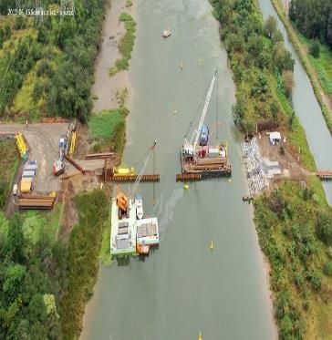 Implementação da proteção das margens do canal e vertedouro; Dois barcos para orientação da navegação