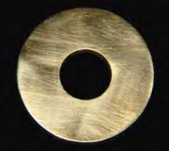 65 Material e Método circular contendo um orifício de 9,0 mm de diâmetro e 3,0 mm de espessura (Fig. 1). FIGURA 1.