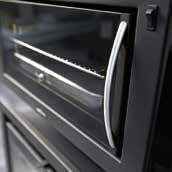 Removable stainless steel inside for easy cleaning, light to improve vision inside the oven and pipe for the evacuation of the gases inside.