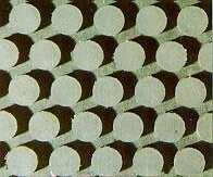 72 Figura 3.5.10 Detalhe da superfície de filtração da placa Fonte: Catálogo da Edwards & Jones 3.5.6 Elementos filtrantes No início, quase a totalidade dos tecidos de filtro prensa eram de fibra de algodão.