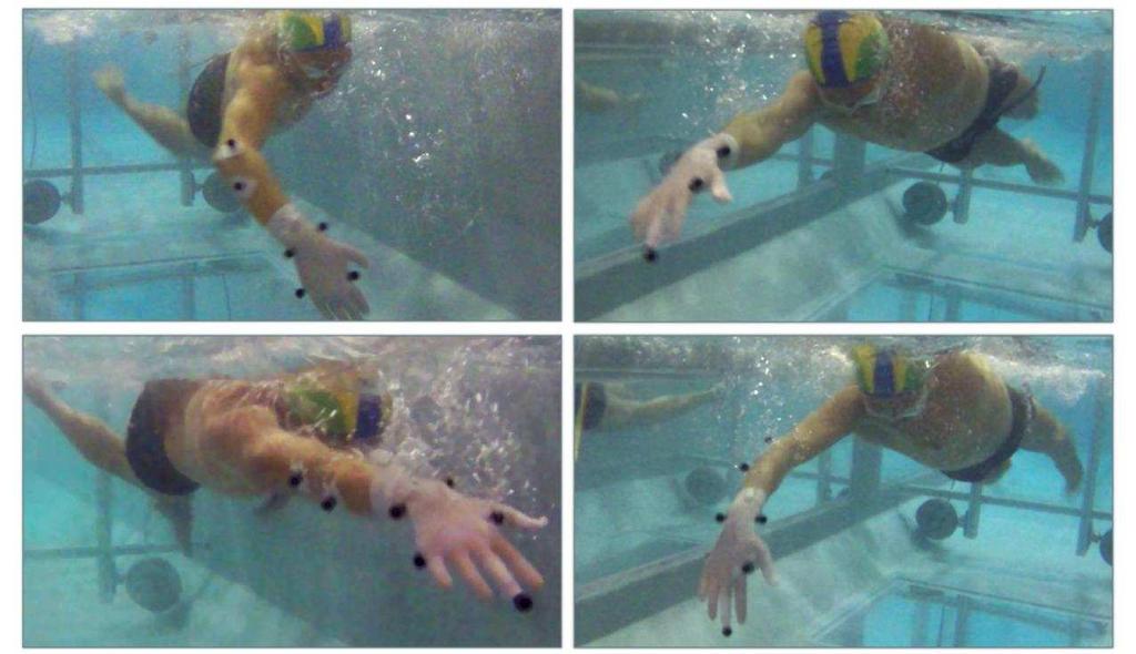27 Figura 5. Dois momentos do ciclo da braçada do nado crawl registrado por duas câmeras. O nadador está equipado com marcadores de superfície fixados no braço direito.
