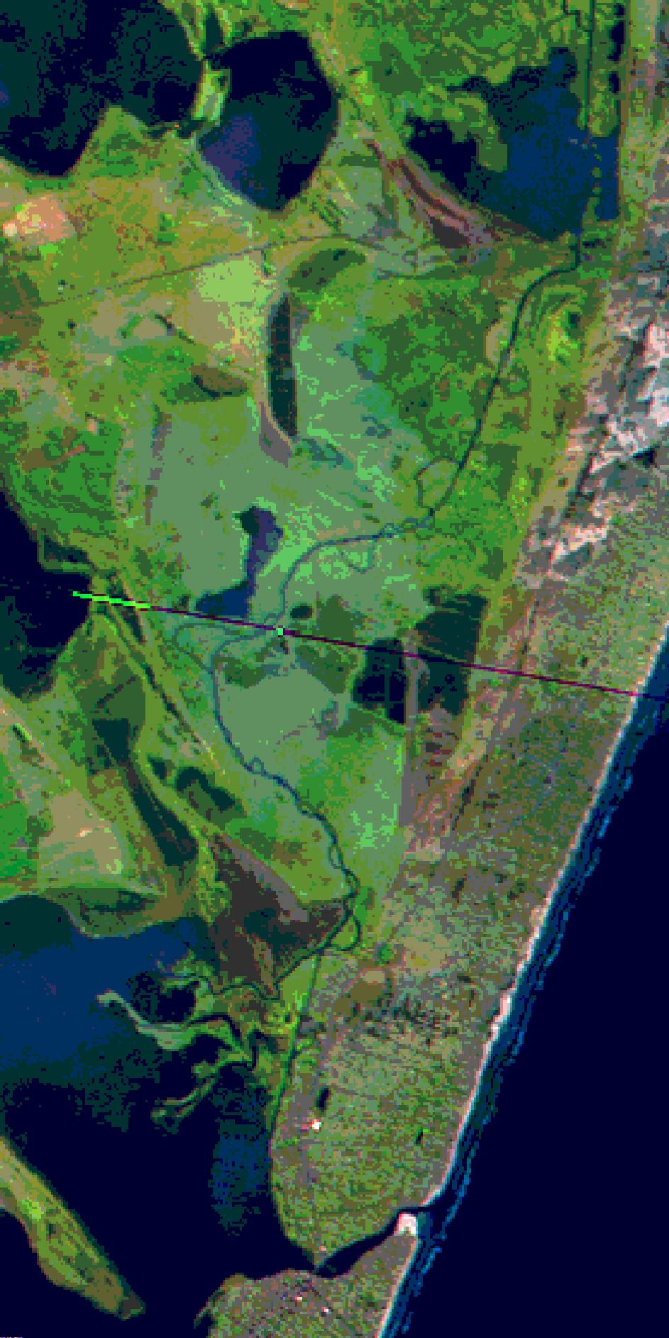 (a) (b) Figura 2. (a) Imagem satélite LANDSAT, (b) Classe de rugosidade extraída a partir de imagem do satélite. Cada cor da imagem da Fig.