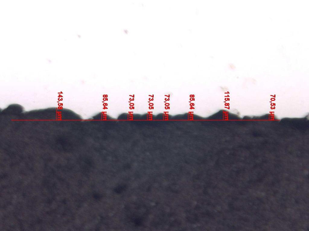 Fig. 8 Seção transversal da amostra jateada com Grittal G150, ampliada 25x Fig.