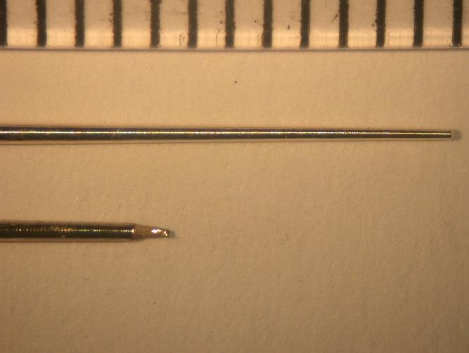 Figura 67 - Análise em Microscopia Óptica. (A) cone de prata antes da polarização anódica. (B) cone após a polarização anódica.