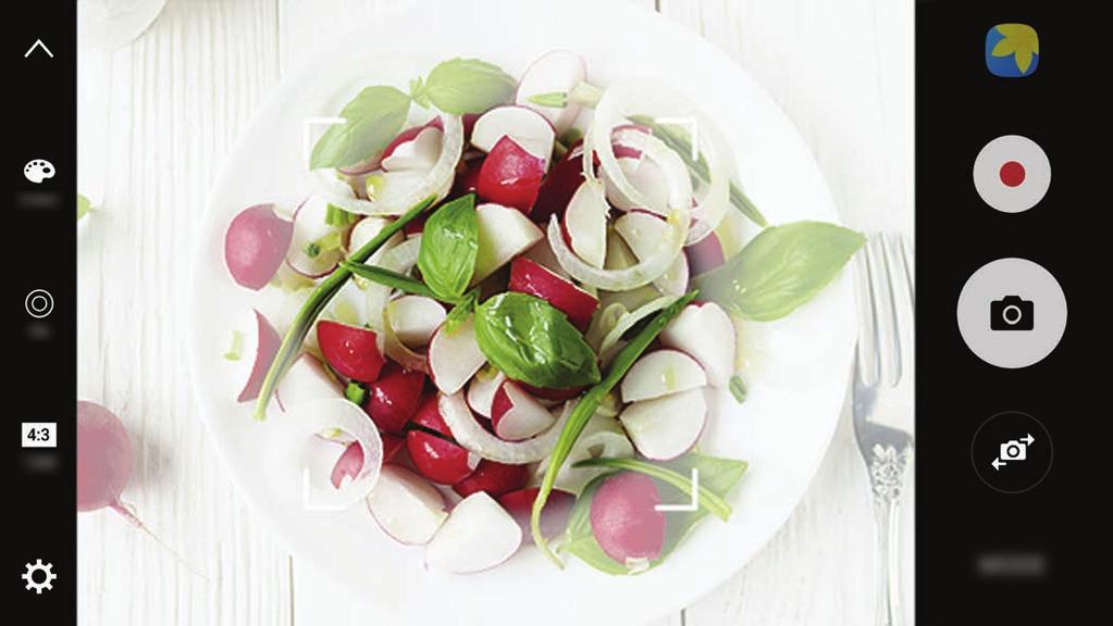 Aplicações Alimentos Tire fotografias de comida com cores mais vibrantes. 1 No ecrã de pré-visualização, toque em MODO Alimentos. 2 Toque no ecrã e arraste a moldura circular sobre a área a realçar.