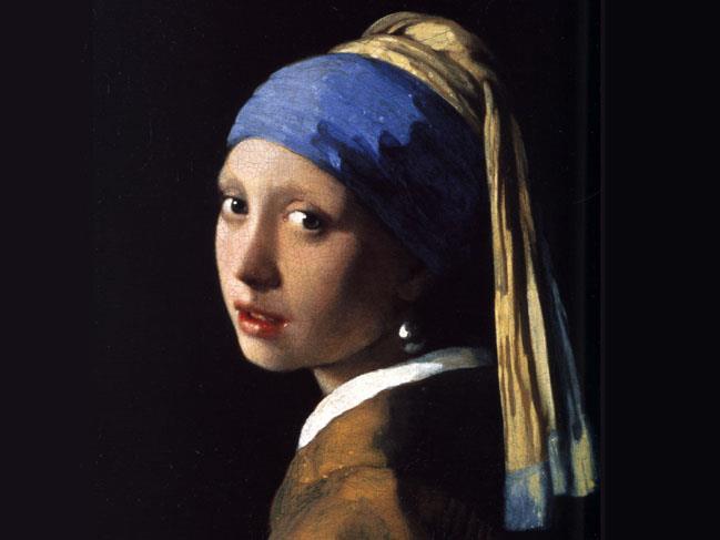 Moça com Brinco de Pérola, Johannes Vermeer O efeito de brilho nas roupas e nos lábios são características marcantes