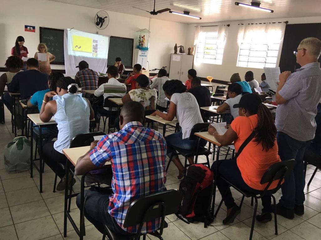 Programas Sociais Aulas de português para imigrantes Haitianos Programa em parceria com universidade Católica, voltado ao ensino da língua portuguesa a haitianos e a inserção social na localidade do