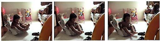 13 Interação 3: Balançando-se na cadeirinha e ninando (1;9) A criança está no quarto interagindo com a díade e vai até a sua cadeirinha de