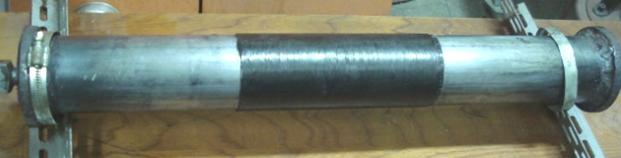 Considerando que a espessura da manta da fibra é de 0.165mm e foram utilizadas 4 mantas, a espessura total de fibra é de 0.66mm, isso representa uma fração volumétrica de 0.