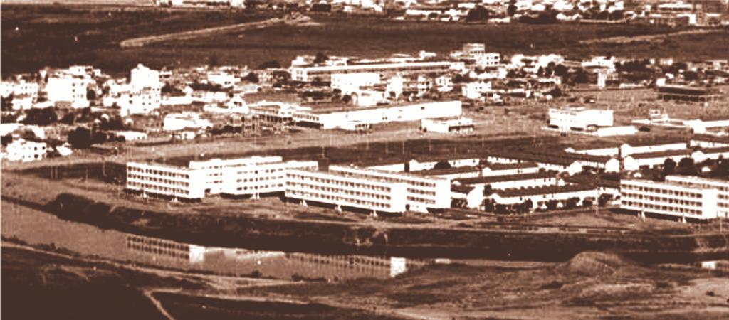 Originouse de áreas de expansão da Companhia Siderúrgica Nacional; nele encontravase o local denominado Acampamento Central, destinado a abrigar operários da CSN e o Hospital, com unidades