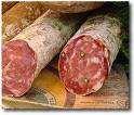 Salame Definição: produto cárneo industrializado obtido de carne suína ou suína e bovina, adicionado de toucinho, ingredientes, embutido em