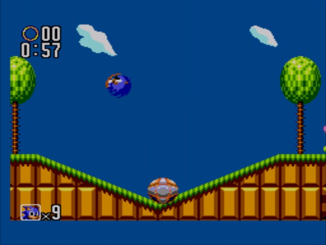 Quando chegar à rampa role e solte os controles e Sonic irá cair em cima da mola agora controle o impulso nova-mente e acerte uma das molas que estão logo acima.
