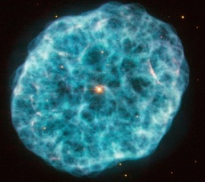 19.dez.2014 - Este "glitter cósmico" é uma galáxia anã compacta e azul conhecida como Markarian 209.