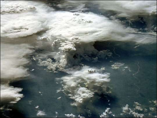This photograph, acquired in February 1984 by an astronaut aboard the space shuttle, shows a series of mature thunderstorms located near the Parana River in southern Brazil.