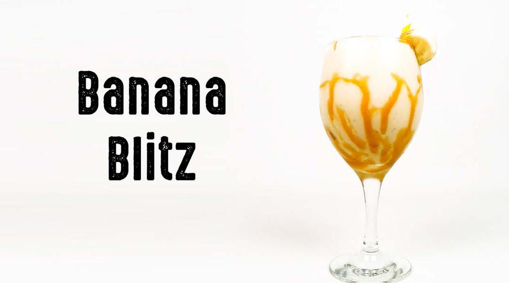 No Liquidificador: 1 copo de Gelo triturado 1 Banana Nanica em rodelas congelada 1 dose de Calda de Caramelo 1 dose de Creme de Leite 2 doses de Rum Bater Em