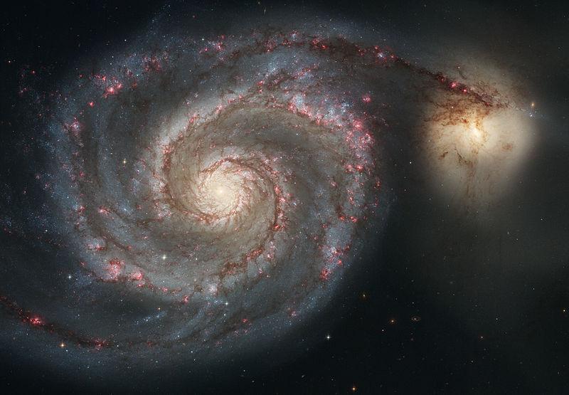 Duas galáxias espirais em colisão.