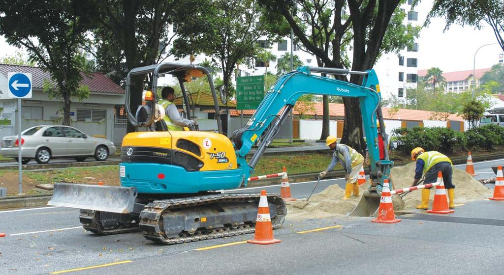 Miniescavadeira Kubota em ação A miniescavadeira