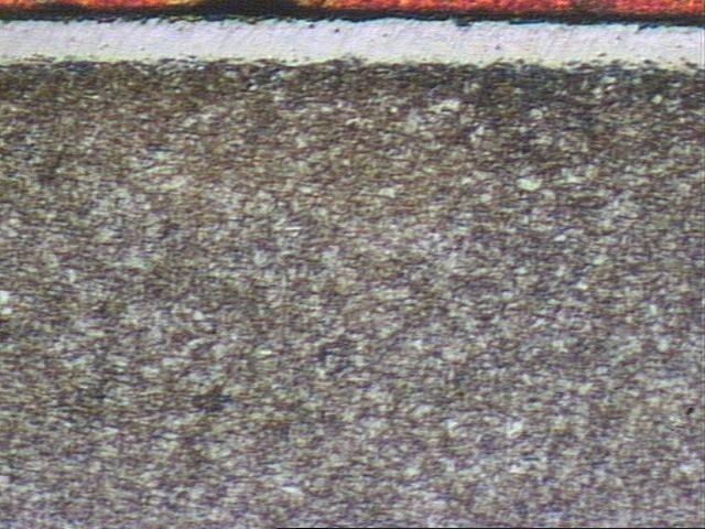 Figura 05 - Micrografia da camada branca para haste de mola a gás nitrocarbonetada pelo processo banho de sal aumento 200x, ataque nital 5% Figura 06 - Micrografia da