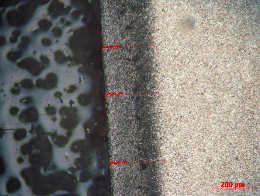 14 FIGURA 6 Foto retirada do microscópio óptico com resolução de 10x10 (objetiva x ocular), com ataque químico.