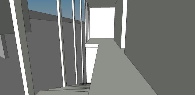 compressão espacial que é abrandada pela grande esquadria que ladeia a escada, visualizando-se a construção secundária do caseiro e o