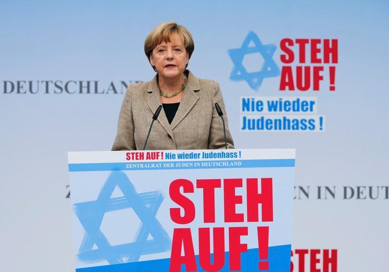 German Chancellor Angela Merkel makes an address during an anti-semitism demo at Berlin's Brandenburg Gate September 14, 2014.