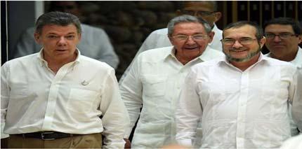 MUNDO América Latina Colômbia anuncia 1ª parte de acordo de paz com as Farc O presidente colombiano Juan Manuel Santos e o líder máximo das Forças Armadas Revolucionárias da Colômbia (Farc), Rodrigo