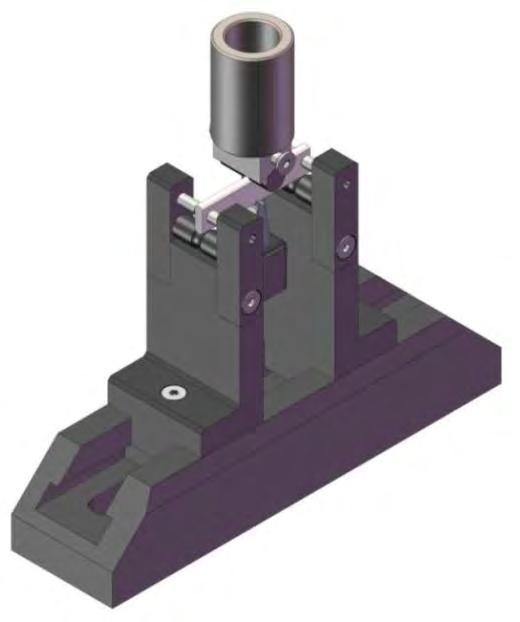 Figura 4. Representação esquemática e fotografia da configuração do dispositivo para ensaios em flexão três pontos.