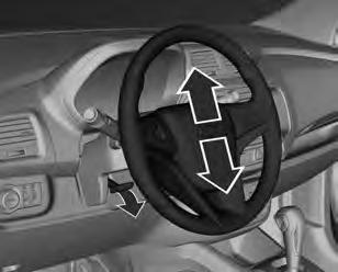 Black plate (7,1) Comandos e controles 5-7 Controles Controles do volante Ajuste de posição do volante Destrave a alavanca, ajuste o volante e