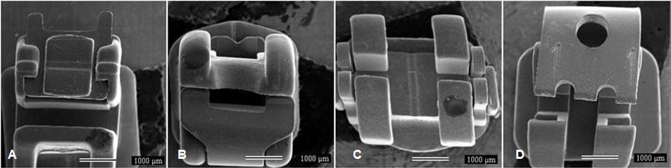 43 3.2 Avaliação das características superficiais dos bráquetes A Figura 1 fornece o resultado obtido pelo microscópio eletrônico de varredura após observar os bráquetes autoligáveis das diferentes