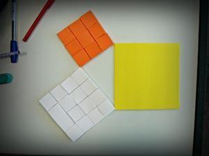 quadrado de lado 12 cm, de cor branca, sobre o quadrado de lado 15 cm (quadrado amarelo), verificando se era possível preencher completamente o quadrado