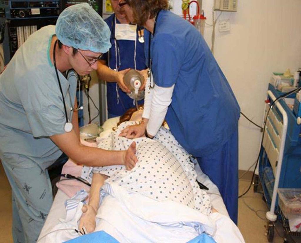 Manual left uterine displacement by the 1-handed technique from the right of the patient during adult resuscitation.