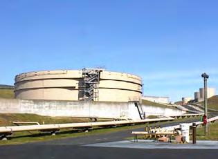 Em 2º plano, a cidade da Praia da Vitória, com o Porto Militar (esquerda) e o Porto Comercial (em cima, ao centro) The South Tank Farm at Lajes Field, Azores.