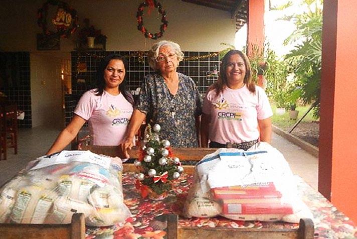 Foto: Arquivo CRC Comissão de voluntariado da classe contábil e mulher contabilista entregando cestas básicas Resumo das Ações por Projeto: Palestra de Gestão Eficiente da Mobilização Social Ação