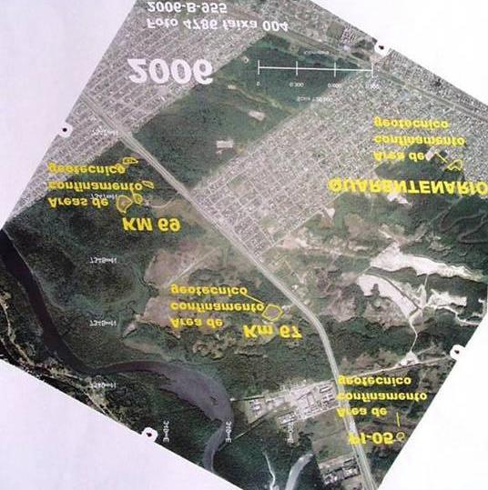 A Foto 11 apresenta uma visão aérea da região de Samaritá com a localização das principais áreas de deposição inadequada dos
