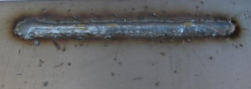 Sobreposição: Excesso de metal da zona fundida sobreposta ao metal de base, na margem da solda, sem estar fundido ao metal de base (Figura 25).