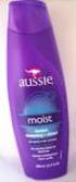 Shampoo Aussie Moist 400 ml, a base de suco da folha aloe vera, óleo de semente de jojoba e algas marinhas do mar da Australia).